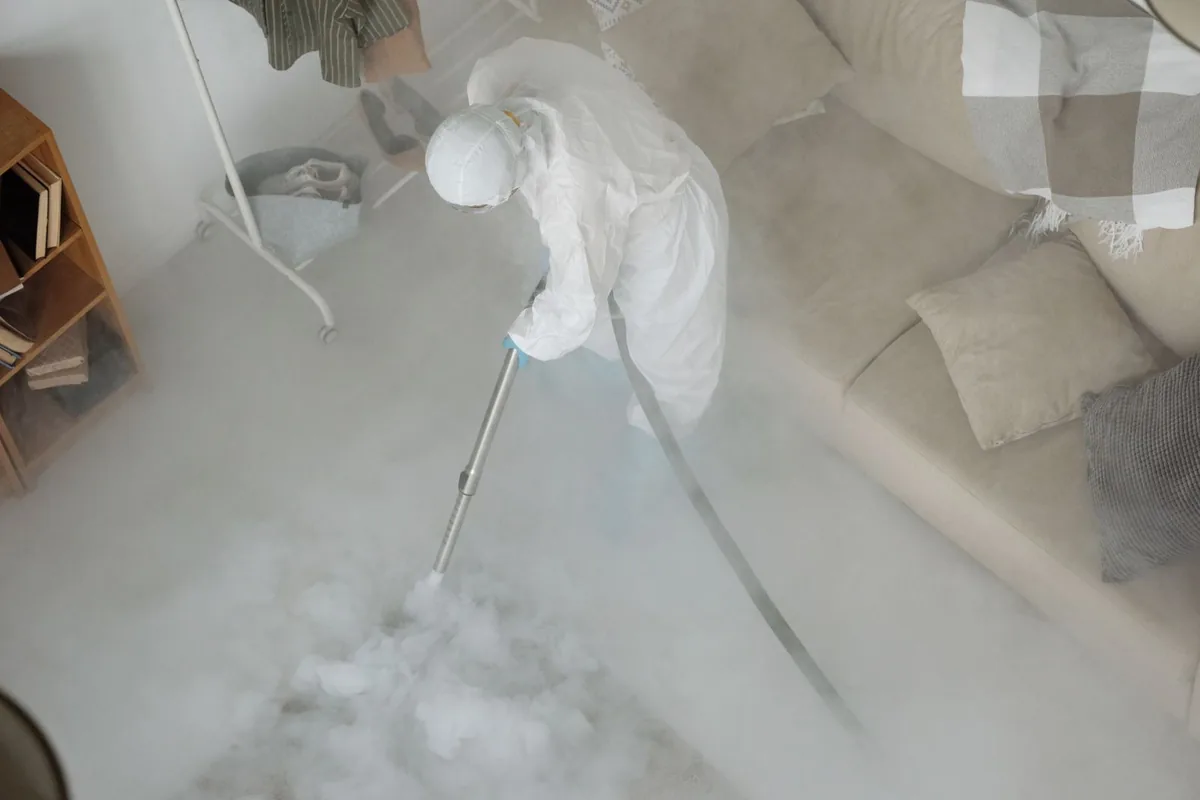 Biohazard cleanup technician in protective equipment, Monticello, KY